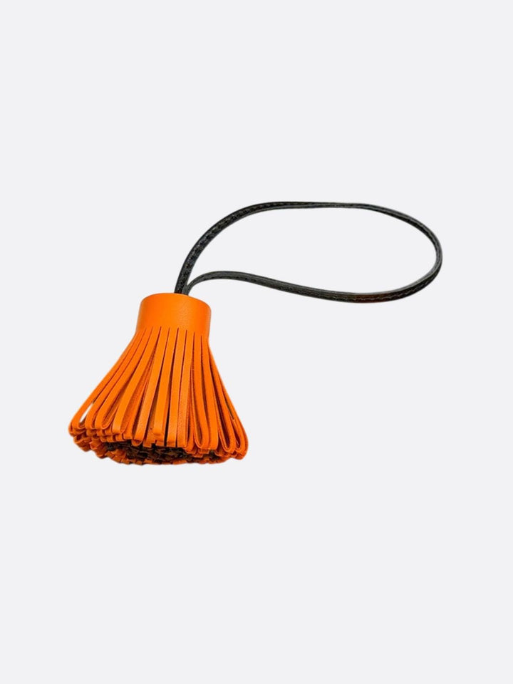 pompon cuir orange et noir